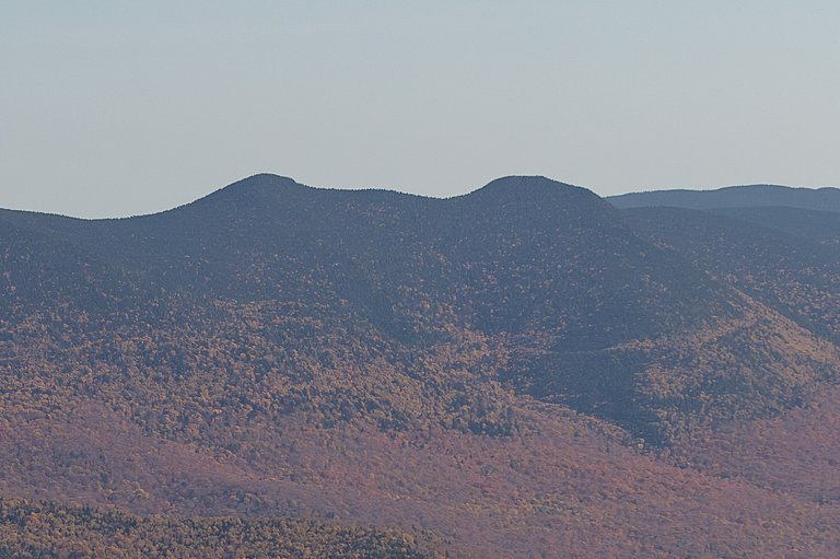 Middle Tripyramid ridge in White Mountains with fall colors under clear sky