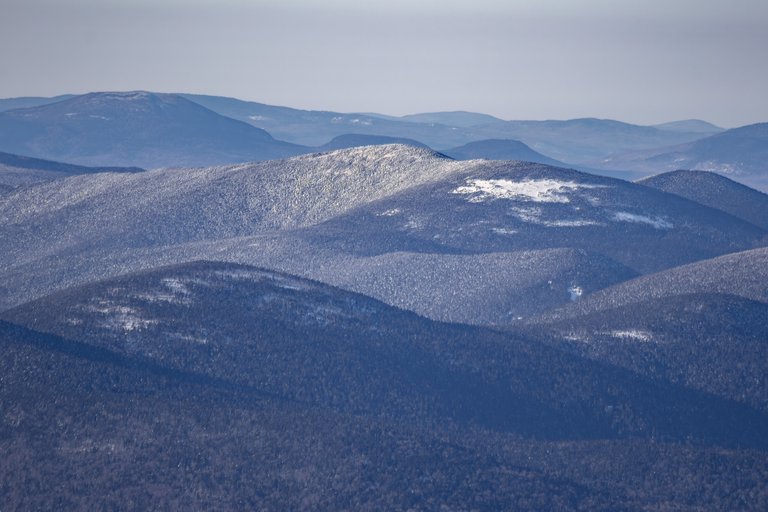 Snow-covered Mount Cabot ridge in White Mountains under winter afternoon light