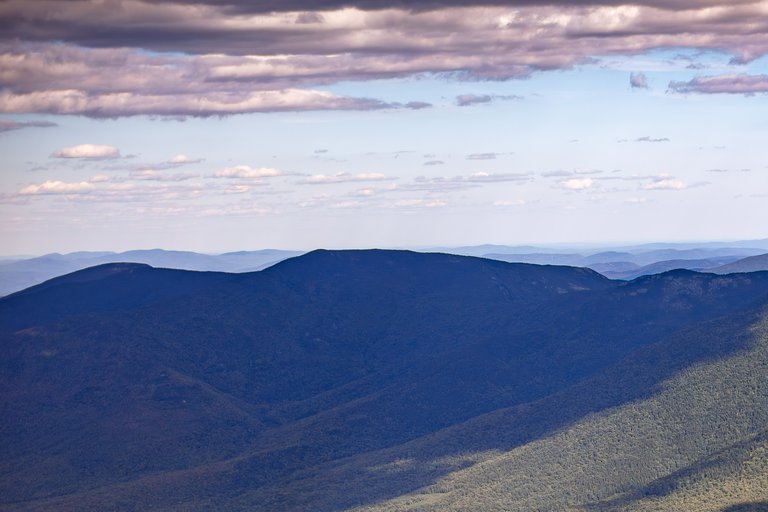 Mount Moriah peak under scattered clouds in White Mountains, New Hampshire