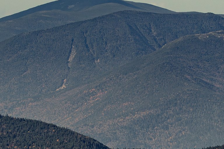 Mount West Bond ridge line in fall afternoon light with forested slopes