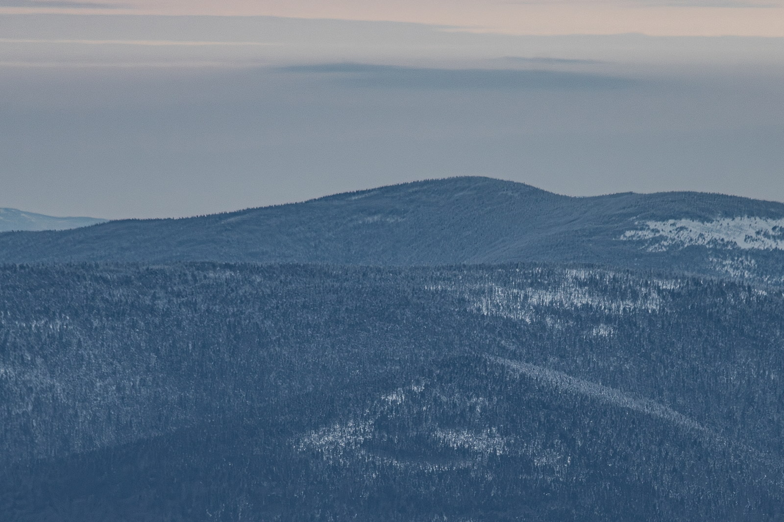 Mount Cabot covered in winter haze under soft afternoon light in White Mountains
