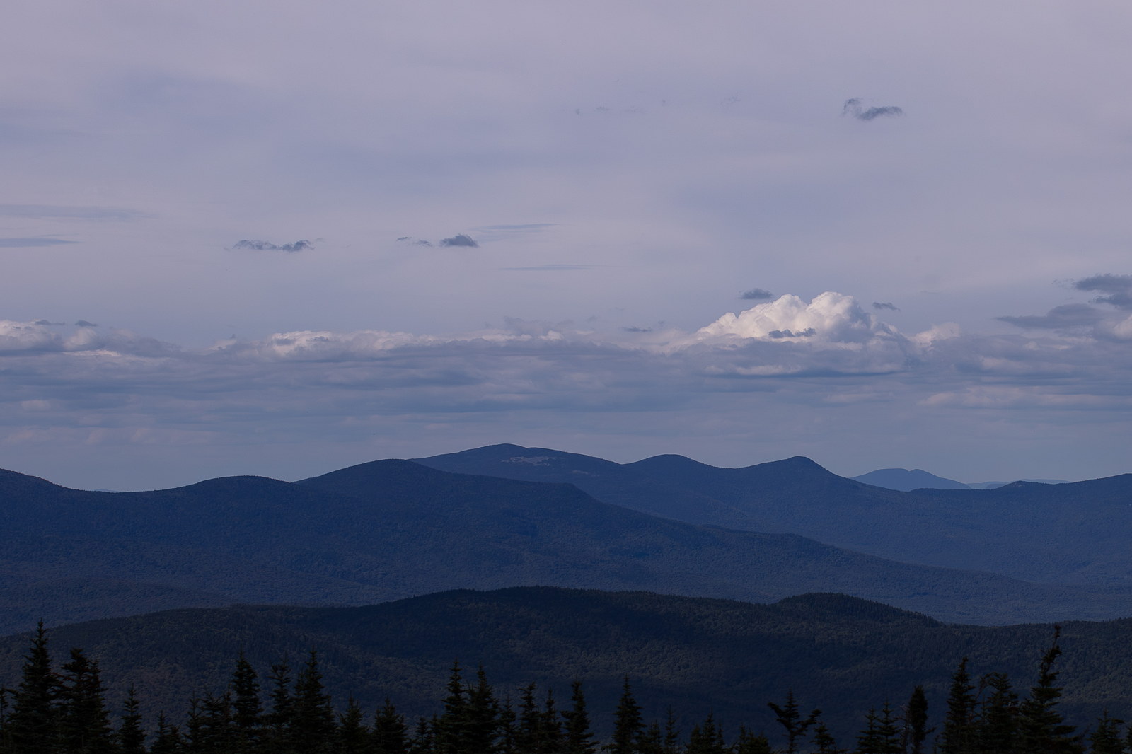 Mount Cabot in White Mountains under soft summer haze and scattered clouds