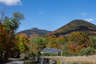 Forested mountain ridge and summit of Mount Whiteface in the White Mountain National Forest under a partly cloudy sky.