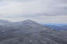 Forested mountain ridge and summit of North Kinsman Mountain in the White Mountain National Forest under a partly cloudy sky.
