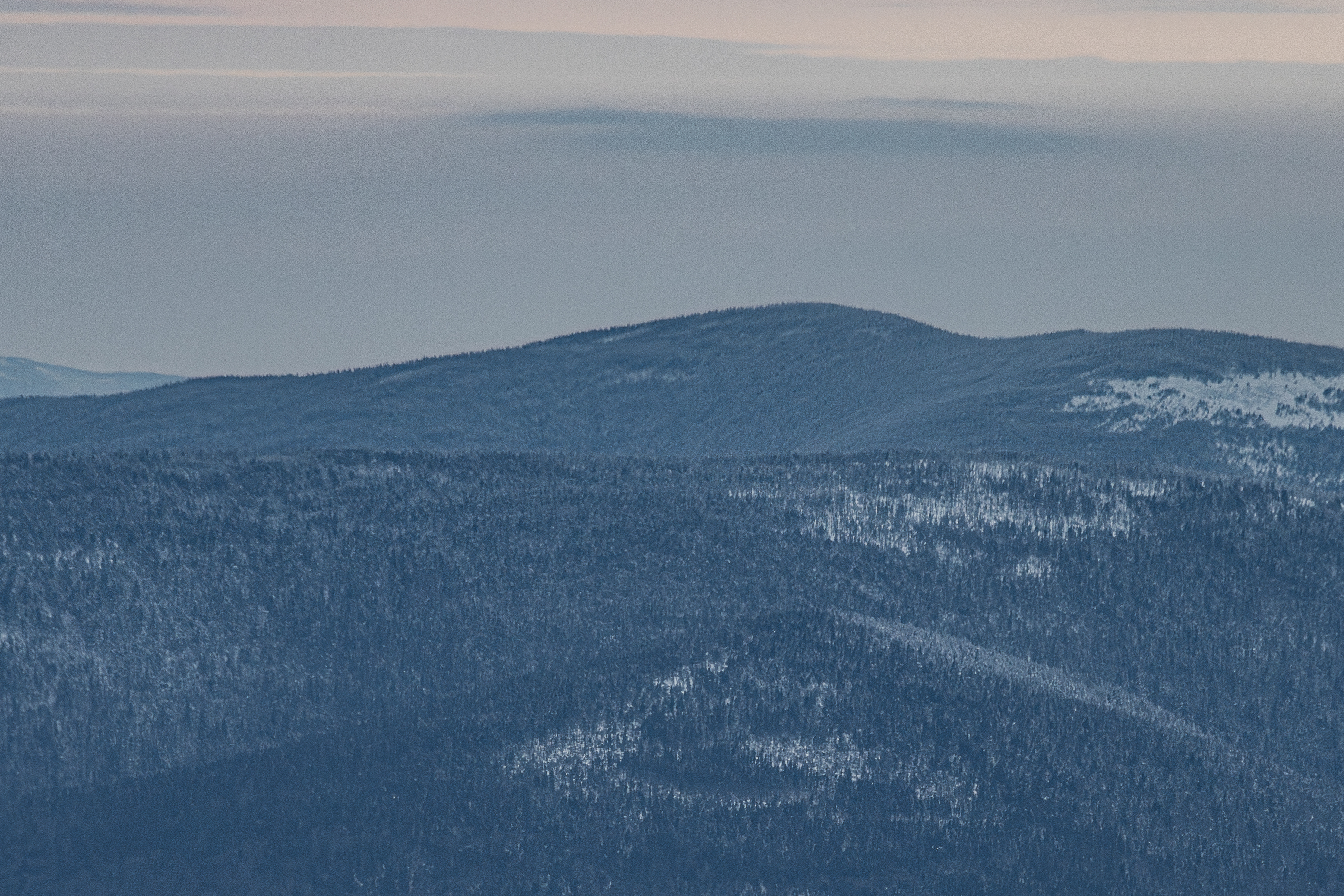 Mount Cabot covered in winter haze under soft afternoon light in White Mountains